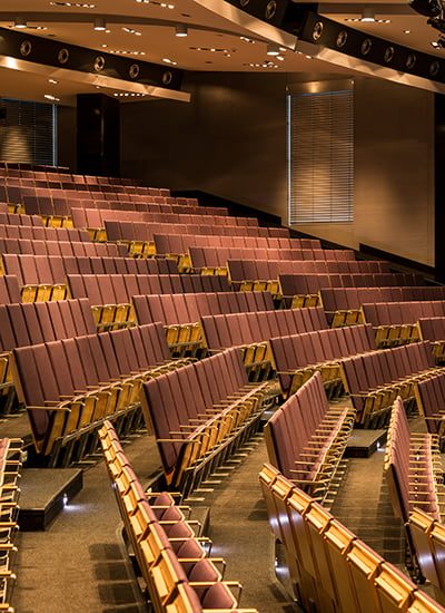 Cropped shot of a spacious lecture room with wooden lecture seats